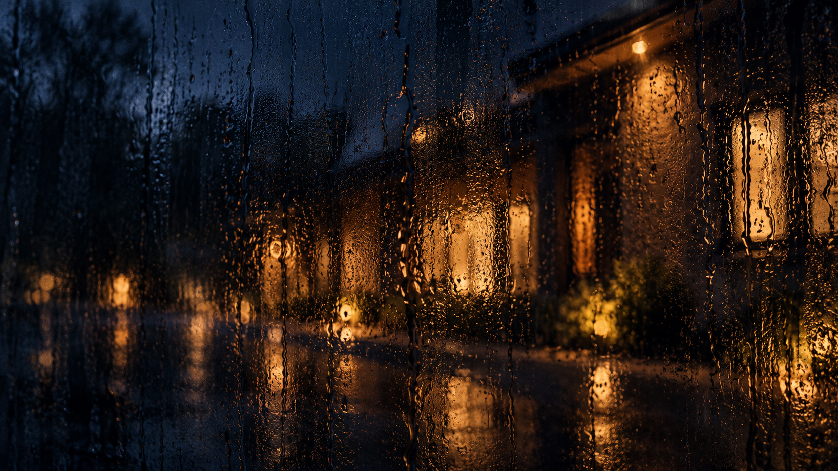 Warm architectural light through rain glass