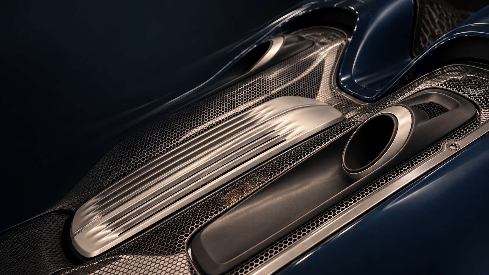 Sculptural silver and carbon automotive detail